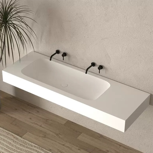 Floating corian bathroom vanity with seamless and integrated sink