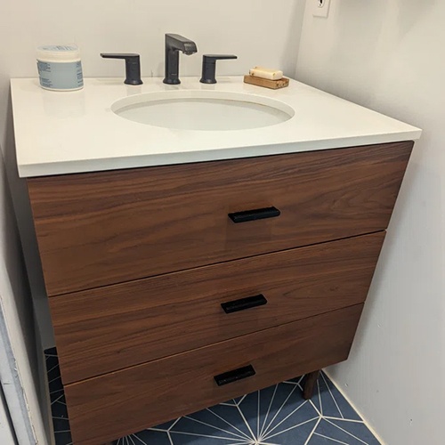 Single bathroom vanity with white quartz top