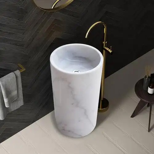White marble pedestal bath vanity with basin