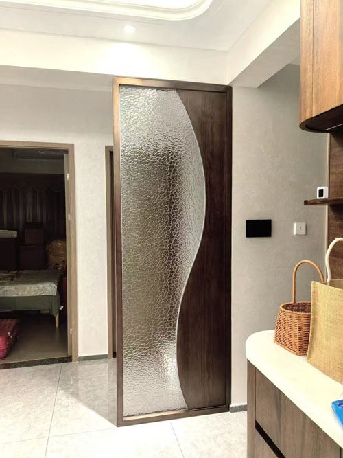 metal framed glass wall with wood panel insert