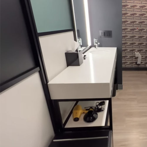 Bath vanities with backwall room divider with metal frame for Aloft by Marriott hotel