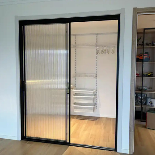 walk in closet with aluminum glass sliding door