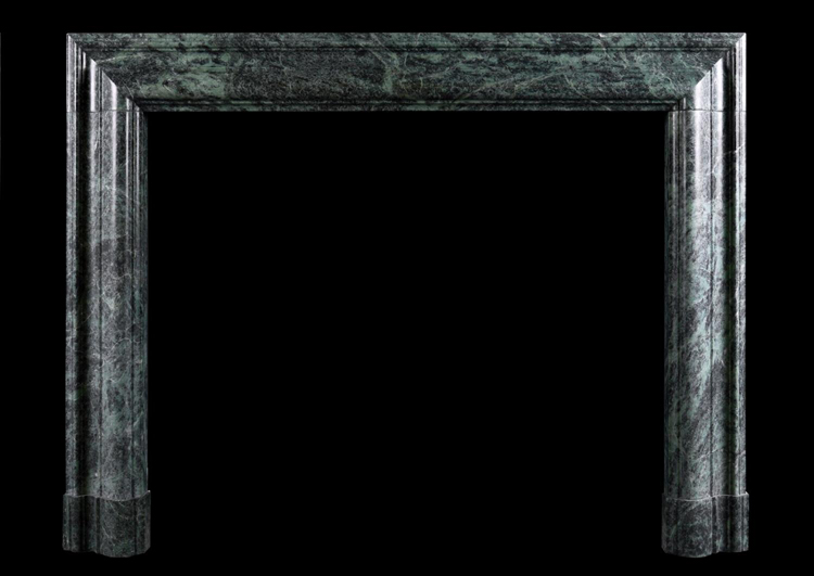 A QUEEN ANNE STYLE BOLECTION FIREPLACE IN GREEN MARBLE