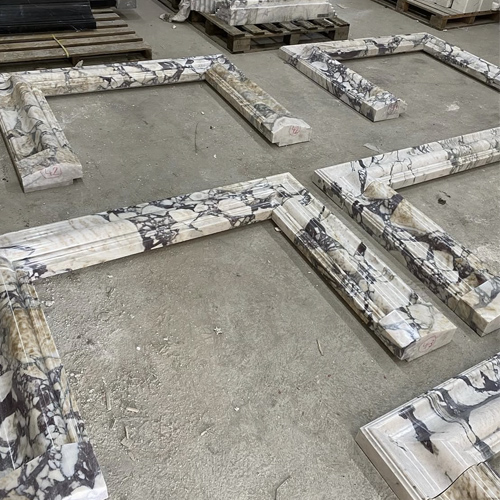 Breccia marble bolection fireplace
