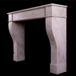 A RUSTIC FRENCH FIREPLACE IN TRAVERTINE STONE
