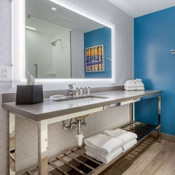 Bath Vanities with Polished Chrome Metal Base in Cambria Hotel