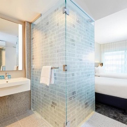 Bathroom shower cubicle with printed opaque glass in Holiday Inn Express Adelaide