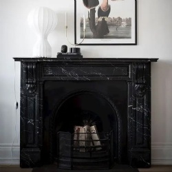 Black Marble Fireplace and Whimsy Artwork