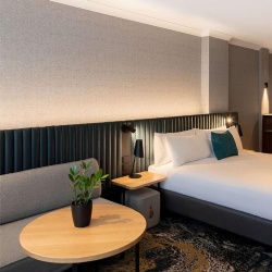 Channel upholstered headboard and seating furniture for Novotel hotel room