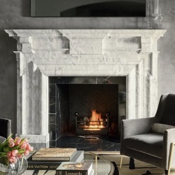 Designer marble fireplace mantel listed in architectural digest