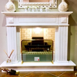 Fireplace cornice surrounding in white marble