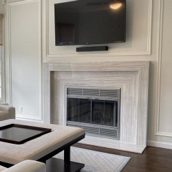 Fireplace mantel features driftwood marble