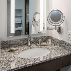 Granite bath vanity top and wood apron