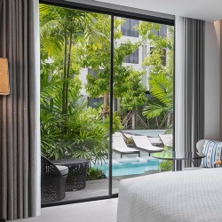 Interior sliding patio aluminum door in hotel guestroom