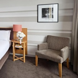 Lounge chair and wall artwork in View hotel room Sydney