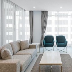 Loveseat sofa and lounge chair in Meriton Suites Sydney