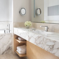 Marble apron front bathroom vanity in Four Seasons hotel and resort