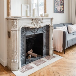 Parisian apartment with french louis XV style marble fireplace mantel