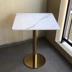 Table with metal base and artificial stone top