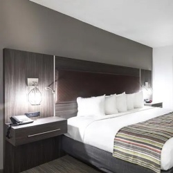 Wall headboard with cantilevered nightstand