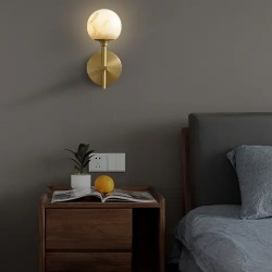 Wall sconce lighting above bed nightstand