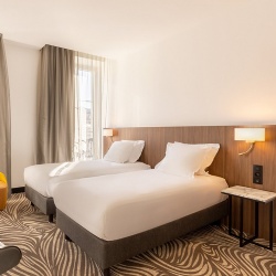 Wood Tone Headboard in Hotel Guestroom