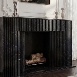 black fluted marble fireplace mantel