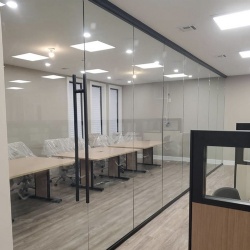 full height glass wall in workspace conference room