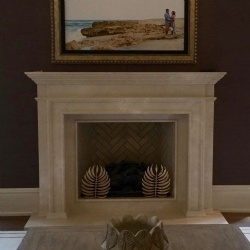 rustic charm of Tuscan carved limestone fireplace mantel