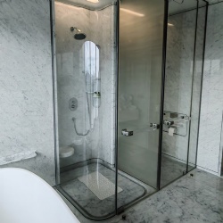 shower enclosure with curved architectural tempered glass